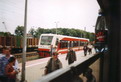 powiększ