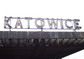 powiększ