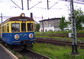 powiększ