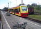 powiększ