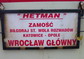 powiększ