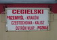 powiększ